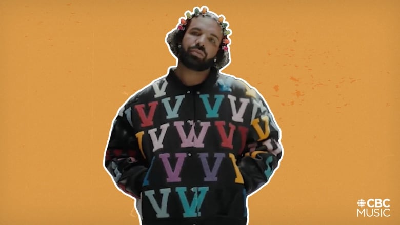 Drake wears a multicoloured sweater and hair clips.